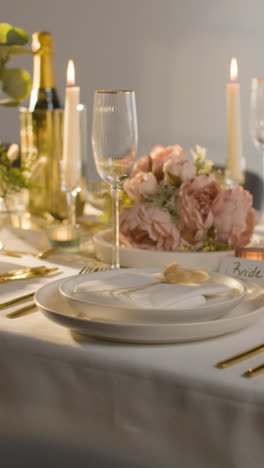 Vertical-Video-Close-Up-Of-Vertical-Video-Of-Table-Set-For-Meal-At-Wedding-Reception-With-Place-Card-For-Bride-1